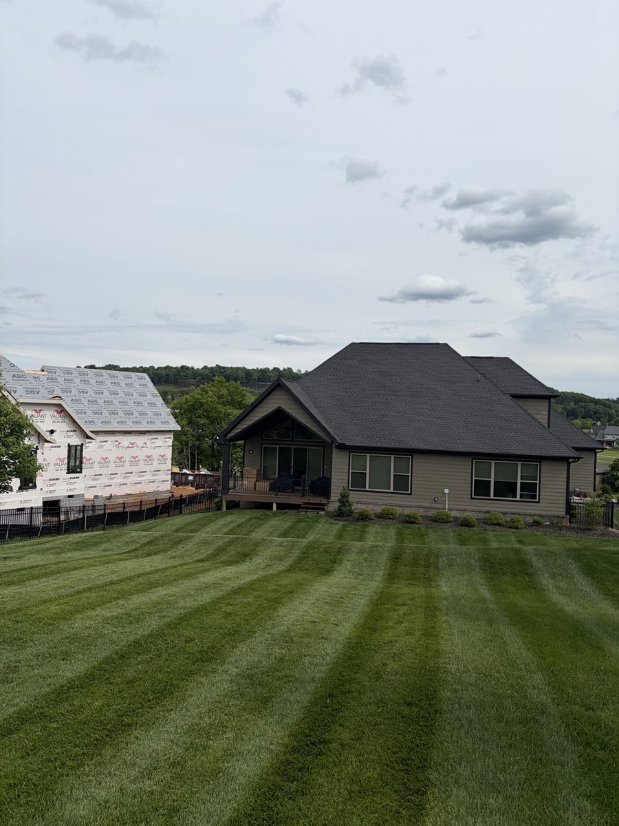 Large striped lawn and home exterior